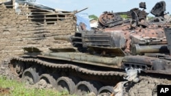 Tanks that have been destroyed during fighting between government and opposition are seen on July 10, 2016, in the Jabel area of Juba, South Sudan, July 16, 2016.