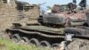 FILE - Tanks that have been destroyed during fighting between forces of Salva Kiir and Riek Machar, on July 10, 2016, in Jabel area of Juba, South Sudan.