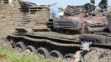 FILE - Tanks that have been destroyed during fighting between forces of Salva Kiir and Riek Machar, on July 10, 2016, in Jabel area of Juba, South Sudan.