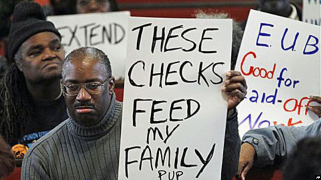 Frank Wallace who is unemployed displays a sign during a "Vigil for the Unemployed" at the Arch Street Methodist Church in Philadelphia, 22 Nov 2010