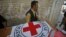 Hospital staff and rescue workers carry the casket of Khalil Rasjed Dale, a British doctor working with the the Red Cross, to an ambulance at a hospital in Quetta, April 30, 2012.