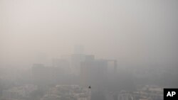 Smog envelopes the skyline in New Delhi, India, Nov. 4, 2020.