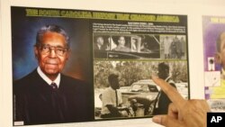 FILE - A display to honor federal judge Matthew Perry is shown by South Carolina civil rights photographer Cecil Williams at his museum, the only civil rights museum in the state, on December 12, 2023, in Orangeburg, South Carolina.