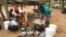 A family in Chachacha village in Chipinge prepares Zimbabwe’s popular, thick porridge called sadza made of corn meal and served with relish, March 2016. Most households eat sadza twice a day, at lunch and dinner. But as the country’s hunger worsens, the s
