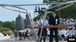 A traffic police officer signals to drivers during a smoggy day in Harbin, China, Oct. 21, 2013. 