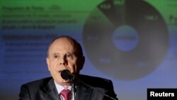 FILE - Brazil's Finance Minister Guido Mantega speaks during the announcement of cuts in the Federal Budget, at the Finance Ministry in Brasilia, Feb. 20, 2014. 