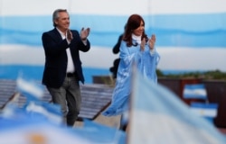 Argentina's presidential candidate Alberto Fernandez and his running mate former President Cristina Fernandez greet supporters during a closing campaign rally in Mar del Plata, Argentina, Oct. 24, 2019.