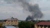 FILE - Black smoke rises above Juba, South Sudan, July 10, 2016. Explosions and heavy weapons gunfire shook the city as government and opposition forces clashed.