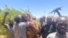 Sudan's military leader General Abdel Fattah al-Burhan receives a kiss from one of his soldiers during the conflict between the Sudanese army and the paramilitary Rapid Support Forces (RSF) in Khartoum