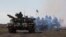 FILE - Ukrainian tanks move near Mariupol, Donetsk region, eastern Ukraine, Oct. 8, 2015. There has been no breakthrough in the latest diplomatic attempt to implement a peace deal in eastern Ukraine.