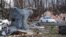 Sheet metal from a home is seen wrapped around a tree in Brookport, Illinois., after tornado hit the small town Sunday, Nov. 17, 2013.