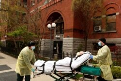 Emergency Medical Technicians (EMTs) wheel a man out of the Cobble Hill Health Center nursing home during an ongoing outbreak of the coronavirus disease (COVID-19) in the Brooklyn borough of New York, April 17, 2020.