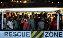 Spanish rescue ship Open Arms with migrants on board arrives in Lampedusa, Italy, Aug. 20, 2019.