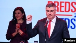 Croatian President and presidential candidate Zoran Milanovic gestures as he delivers a speech after the first results of Croatia's presidential election, in Zagreb, Croatia, Dec. 29, 2024. 