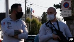 French Police officers stand next to the Police station in Rambouillet, south west of Paris, April 23, 2021, where a French police officer was stabbed to death inside her police station. 