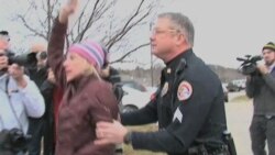 Caucus Protesters Target Republican Candidates