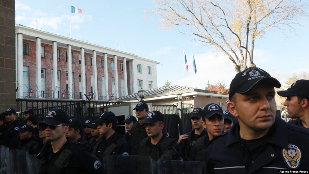 FILE - Turkish riot police stand as protestors demonstrate against France in front of the French embassy in Ankara, on Nov. 11, 2016.