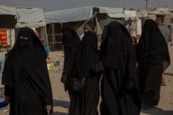 Tens of thousands of Islamic State fighters and their families are detained in camps and prisons secured by Kurdish-led forces, in al-Hol Camp, Syria, Oct. 17, 2019. (Yan Boechat/VO