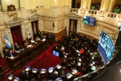 Argentine senators attend a session to debate an abortion bill in Buenos Aires, Argentina, Dec. 29, 2020.