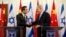 Israeli Prime Minister Benjamin Netanyahu, right, shakes hands with Chinese Foreign Minister Wang Yi before their meeting at the prime minister's office in Jerusalem, Wednesday, Dec. 18, 2013.