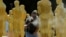 Stage craft artist Rick Roberts gives Oscar statues a fresh coat of gold paint as preparations begin for Sunday's 89th Academy Awards in Hollywood, California, Feb. 22, 2017. 