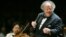 FILE - Boston Symphony Orchestra music director James Levine, right, conducting the symphony on its opening night performance at Tanglewood in Lenox., Massachusetts, July 7, 2006. The Met Opera has fired the music director emeritus, finding "credible evidence" of "sexually abusive" conduct. 