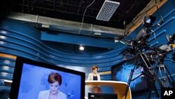 A news anchor provides the news from the studio of PIK [First Caucasus News], a new state-funded, Russian language TV channel designed to break Moscow’s information grip on the region, Tbilisi, Georgia, August 2011