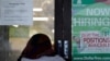 A shopper enters a retail store as a hiring sign shows in Buffalo Grove, Ill., Thursday, June 24, 2021. America’s employers added 850,000 jobs in June, well above the average of the previous three months and a sign that companies may be having an easier…