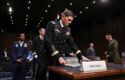 FILE - Gen. Jospeh Votel, then commander of the U.S. Central Command, arrives to testify before the Senate Committee on Armed Services, on Capitol Hill, in Washington, March 13, 2018.