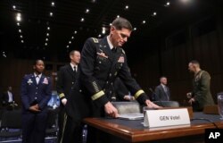 FILE - Gen. Jospeh Votel, then commander of the U.S. Central Command, arrives to testify before the Senate Committee on Armed Services, on Capitol Hill, in Washington, March 13, 2018.