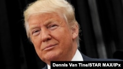 Photo by: Dennis Van Tine/STAR MAX/IPx 2020 12/27/20 Donald Trump signs coronavirus relief and government funding bill into law. STAR MAX File Photo: 4/17/16 Donald Trump campaigns in Staten Island, New York.