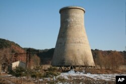 FILE - This photo, taken Dec. 18, 2007, and released June 27, 2008, by the official Chinese news agency Xinhua, shows the cooling tower at the Yongbyon nuclear complex near Pyongyang, North Korea.