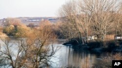 The river Evros is seen from a spot near the Greek town of Didymoteicho, at the Greek-Turkish border, Sunday, Dec. 4, 2016. A migrant was killed by gunfire at the border on April 16, 2022, as she and several others attempted to cross the river from Turkey to Greece.