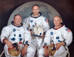 FILE - This March 30, 1969, photo made available by NASA shows the crew of the Apollo 11, from left, Neil Armstrong, commander; Michael Collins, module pilot; Edwin E. "Buzz" Aldrin, lunar module pilot.