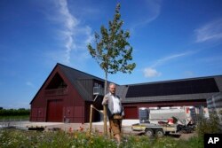 Winemaker and oenologist Felix Åhrberg poses for a picture at Kullabergs Vingård, in Nyhamnsläge, Sweden, Tuesday, July 25, 2023. "Where vineyards in more traditional countries are suffering, we are gaining momentum," Åhrberg said. (AP Photo/Pavel Golovkin)