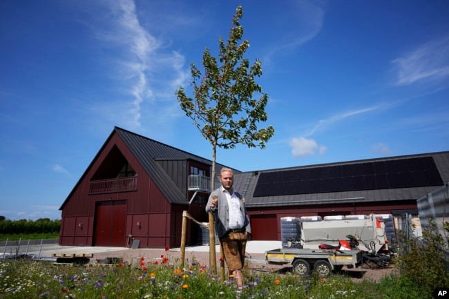 Winemaker and oenologist Felix Åhrberg poses for a picture at Kullabergs Vingård, in Nyhamnsläge, Sweden, Tuesday, July 25, 2023. "Where vineyards in more traditional countries are suffering, we are gaining momentum," Åhrberg said. (AP Photo/Pavel Golovkin)