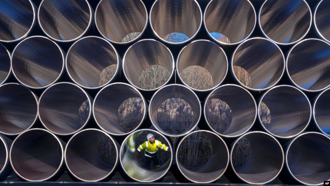 FILE - Tubes are stored in Sassnitz, Germany, to construct the natural gas pipeline Nord Stream 2 from Russia to Germany, Dec. 6, 2016.