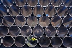 FILE - Tubes are stored in Sassnitz, Germany, to construct the natural gas pipeline Nord Stream 2 from Russia to Germany, Dec. 6, 2016.