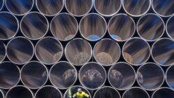 FILE - Tubes are stored in Sassnitz, Germany, to construct the natural gas pipeline Nord Stream 2 from Russia to Germany, Dec. 6, 2016.