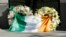 An Irish flag is draped over wreaths at the Library Gardens apartment complex in Berkeley, Calif., where six young people died in a balcony collapse, June 16, 2015.