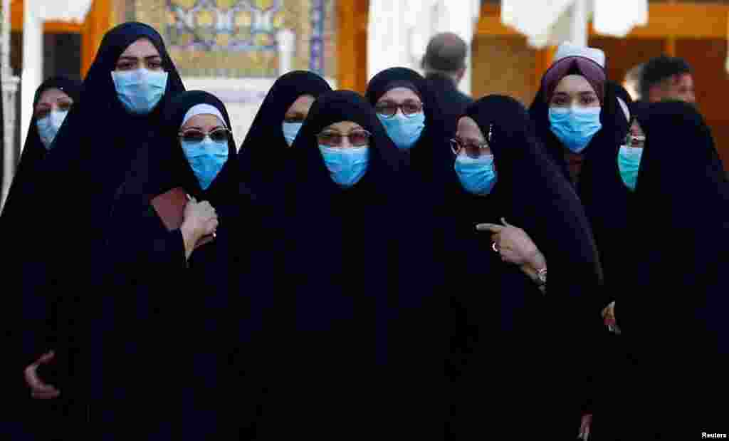 Shi&#39;ite Muslims women wear protective face masks at Imam Ali Shrine, following an outbreak of coronavirus, in the holy city of Najaf, Iraq.
