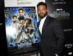 Filmmaker Ryan Coogler poses with a poster from the first movie in the Black Panther series in 2018. (Photo by Evan Agostini/Invision/AP, File)