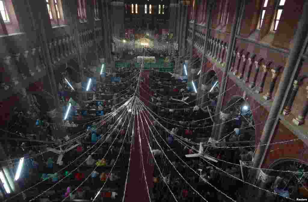 People attend a mass on Christmas day at the Cathedral Church in Lahore, Pakistan, Dec. 25, 2014.