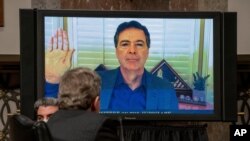 Former FBI director James Comey is sworn via videoconference before testifying during a Senate Judiciary Committee hearing on Capitol Hill in Washington, Sept. 30, 2020.