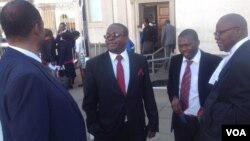 Kudakwashe Bhasikiti (second left) with his lawyer Tendai Biti (far right) - Photo By Thomas Chiripasi 
