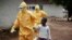 FILE - Nowa Paye, 9, is taken to an ambulance after showing signs of the Ebola infection in the village of Freeman Reserve, about 30 miles north of Monrovia, Liberia, on Sept. 30, 2014.