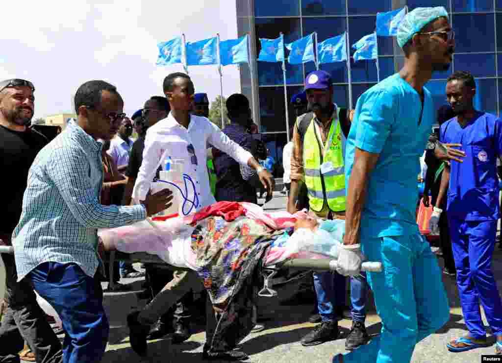 A Somali girl injured in the car bomb explosion at the Afgoye junction is carried on a stretcher to be airlifted for treatment in Turkey, at the Aden Abdulle International Airport in Mogadishu.