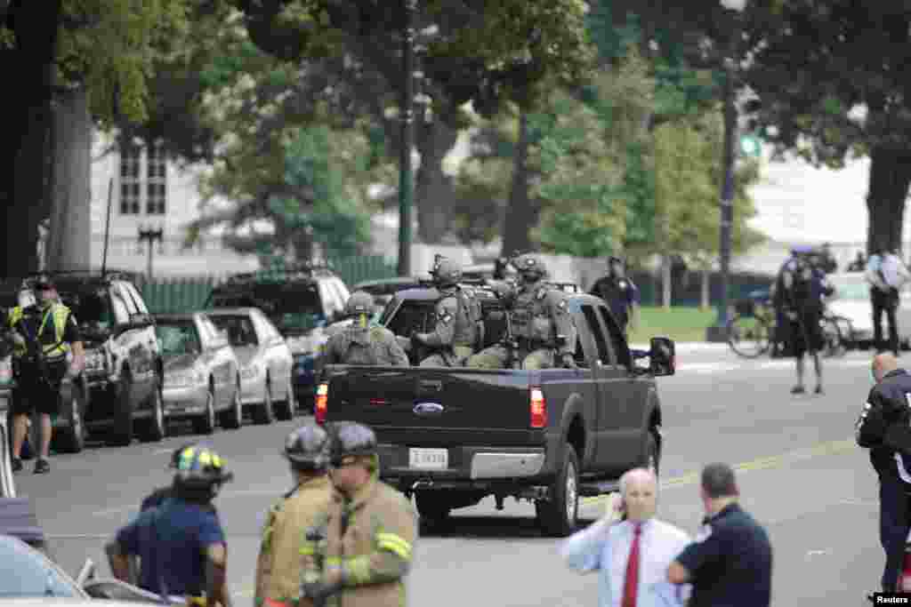 Federal Bureau of Investigation agents patrol after gunshots were fired outside the Capitol.