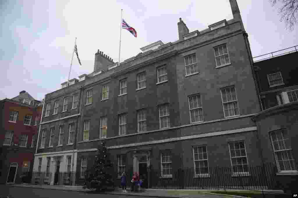 Flags fly at half-mast for the late former U.S. President Jimmy Carter at Downing Street, in London, Dec. 30, 2024.