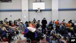Residents wait at a high school gym before they are evacuated as the outer bands of Hurricane Harvey begin to make landfall in Corpus Christi, Texas, Aug. 25, 2017.